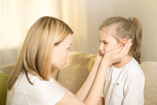 woman consoling daughter