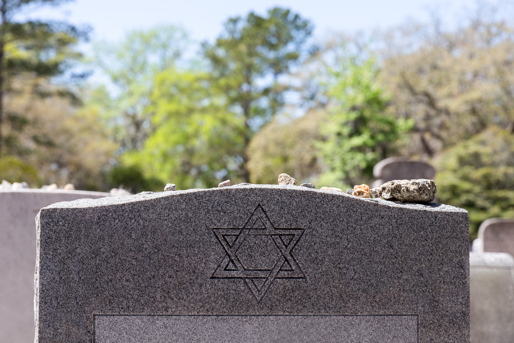 jewish headstone with stone on top