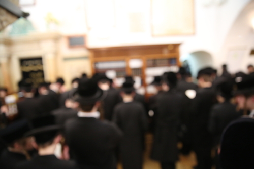 crowd of jewish men at a funeral